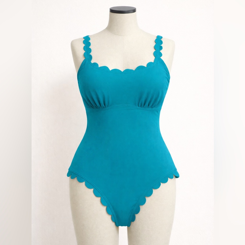 NWT one piece swimsuit. Built in sunscreen 50+. Room for pads-hygenic liner. Med